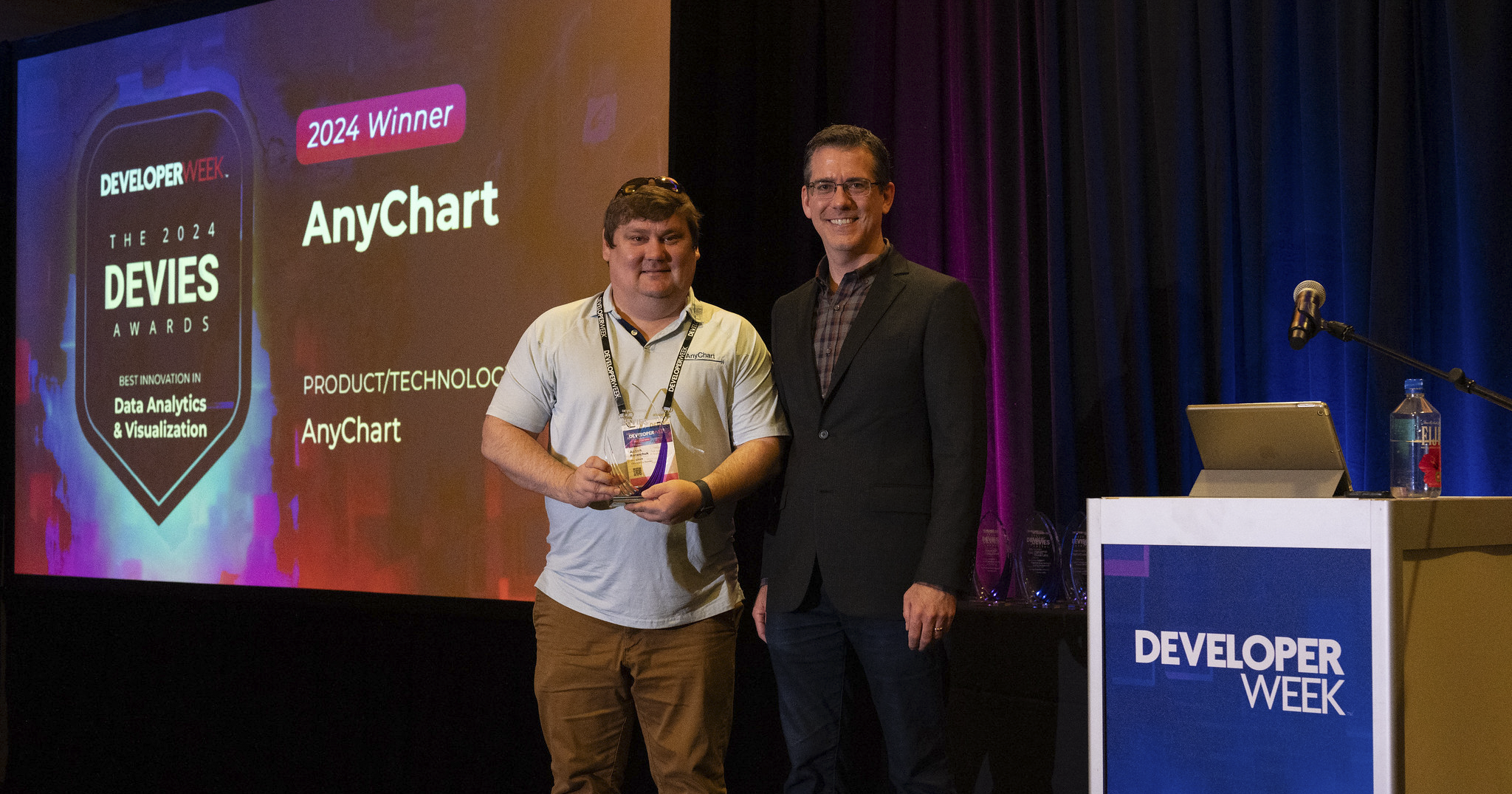 Anton Baranchuk, CEO and co-founder of AnyChart, receives the award from Jonathan Pasky, Executive Producer of DevNetwork, producer of DeveloperWeek and the 2024 DEVIES Awards
